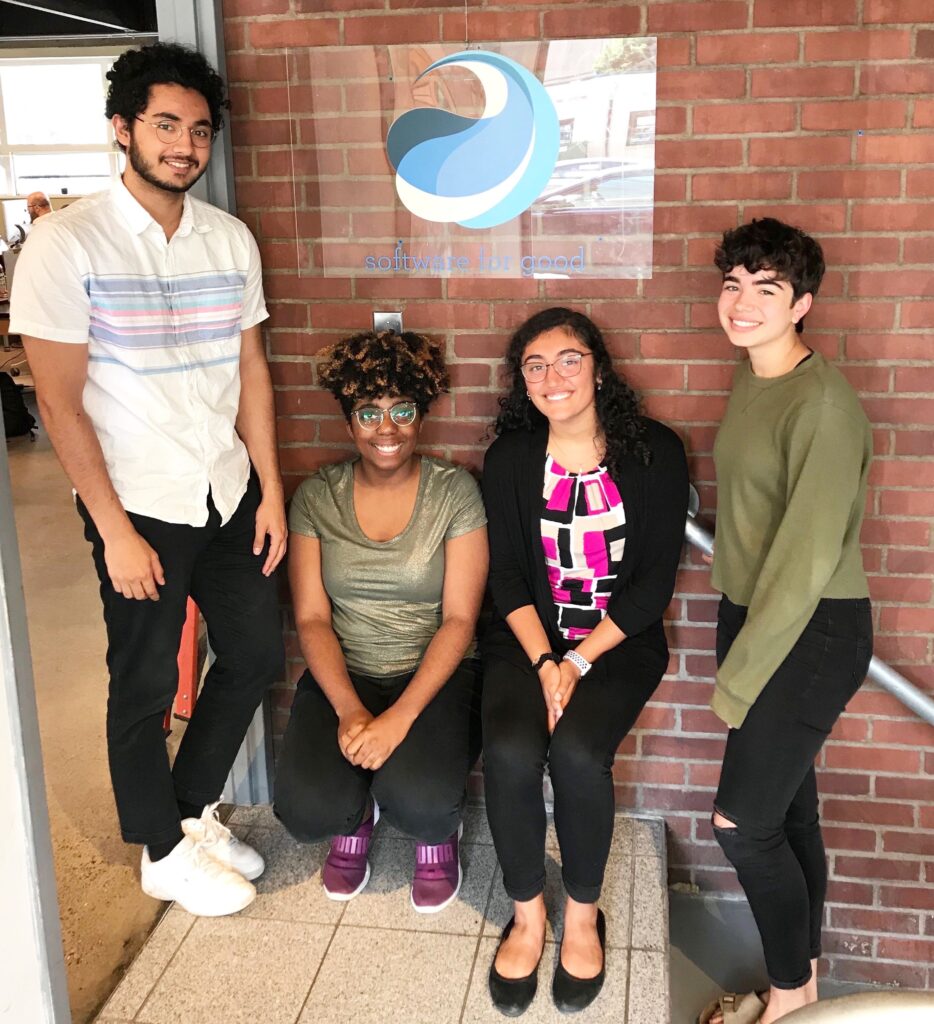 Four interns posing with Software for Good sign.