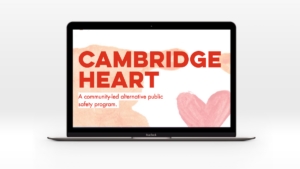 Image of laptop with screenshot showing text: Cambridge HEART. A community-led alternative public safety program.